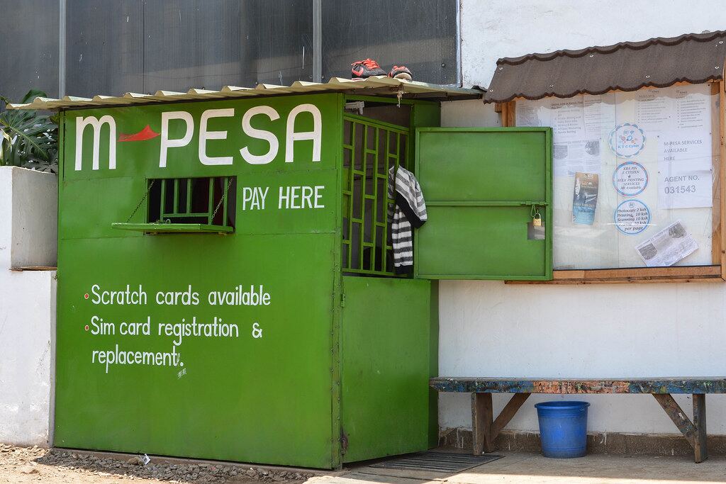 A green M-Pesa kiosk on a street in Nairobi
